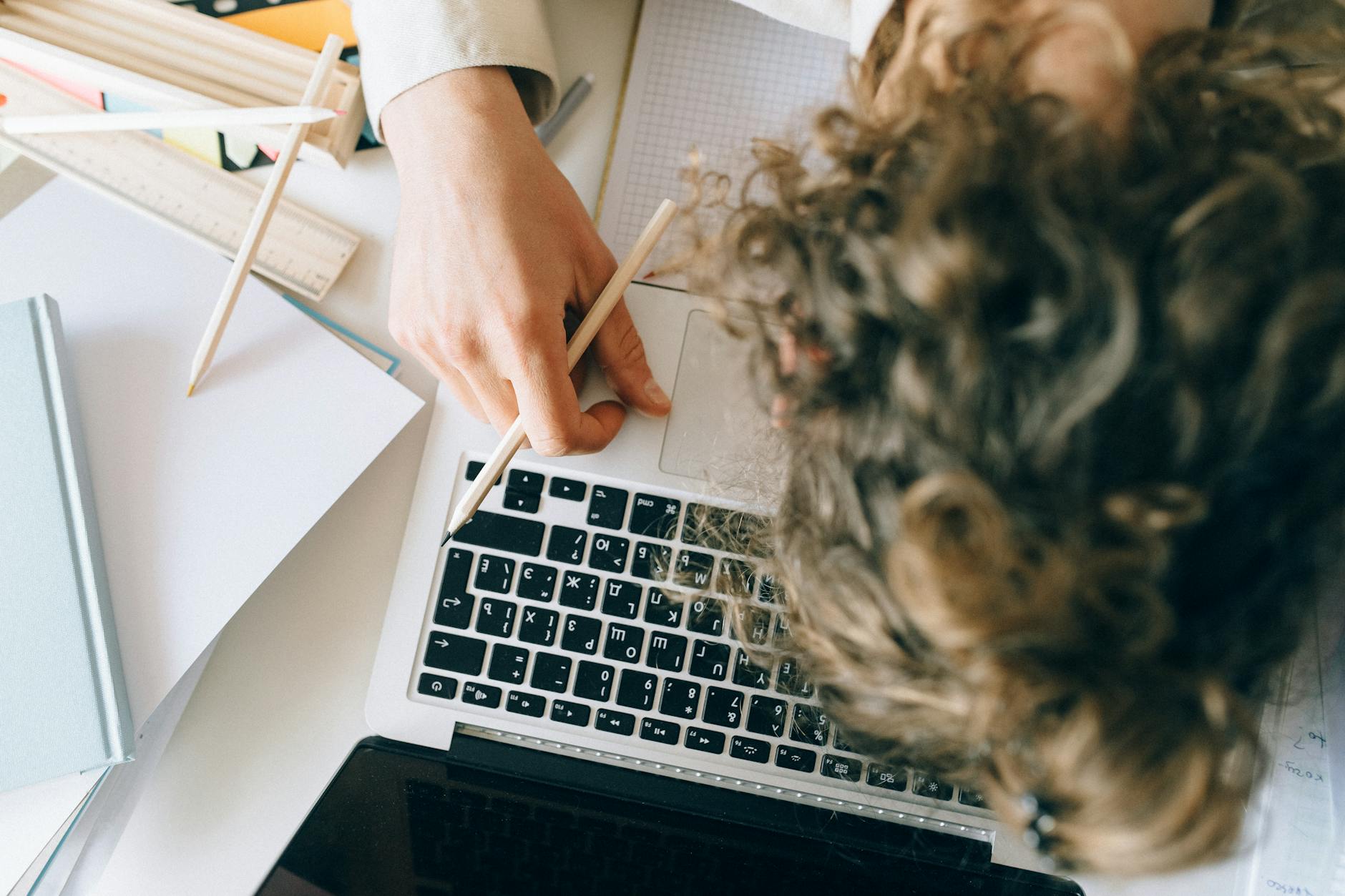 White woman frustrated at her desk.